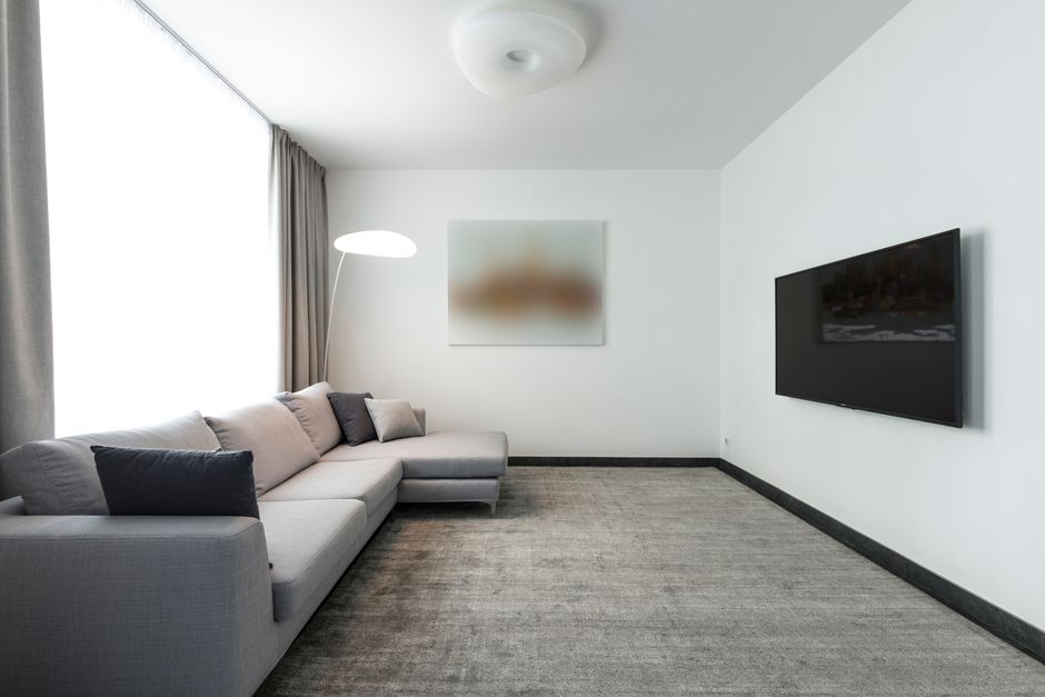 A freshly cleaned living room carpet showcasing our professional carpet cleaning service